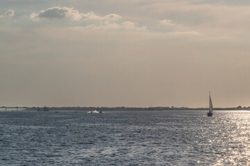 Sailboat on the Kuibyshev Reservoir on the Volga, Sun Glare on the Water's Surface.