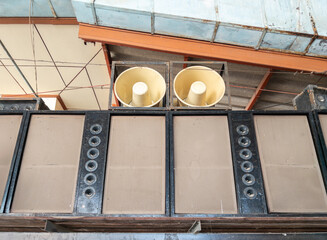 Dual White Megaphones on Large Speaker Cabinet.