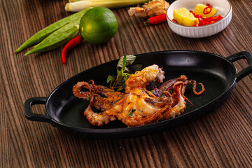 Gourmet grilled whole octopus served lime