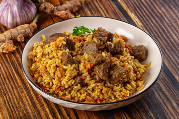 Asian traditional pilaf with beef