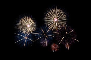 Fototapeta premium Many flashing colorful fireworks in event amazing with black background celebrate New Year, holiday and festival in night.