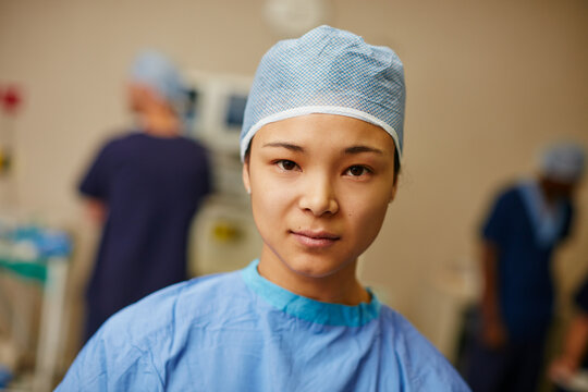 Portrait, woman and nurse in operating room at hospital with confidence for emergency surgery in icu. Professional, scrubs and female healthcare worker for medical service with treatment in clinic. - Powered by Adobe