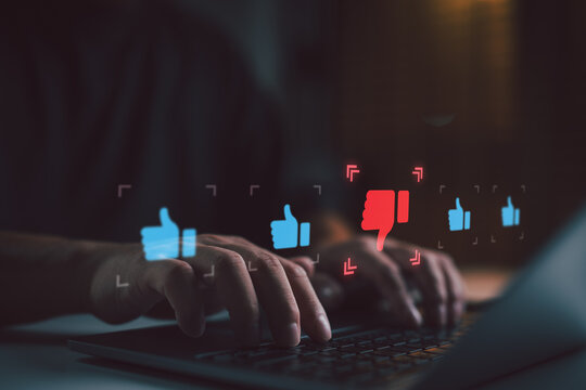 User typing negative online review with thumbs down icon. Concept of bad customer feedback, dissatisfaction, low rating, service criticism, and impact of negative reviews on digital reputation.