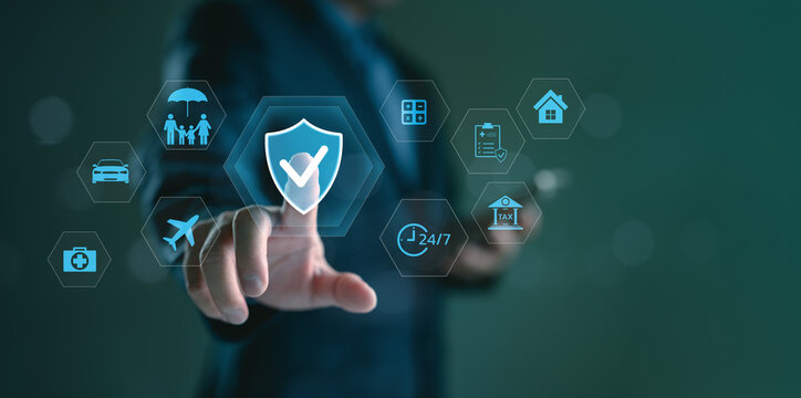 Businessman touching digital screen with insurance icons. Concept of online insurance service, protection plan, financial security, and insurtech innovation for health, travel, and property coverage.