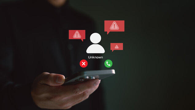 Phone screen alerting unknown scam call. Concept of phone fraud, spam calls, scammer warning system, and cybersecurity protection. Mobile safety technology against phishing and fake calls.