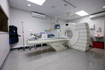 Medical, mri and machine in room at hospital for treatment, cancer or radiology for diagnosis. Ct scan, healthcare ward and equipment for oncology testing with consultation or checkup in empty clinic