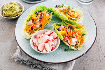 Healthy vegetable wraps with lettuce and avocado dip