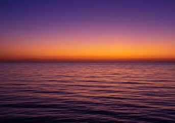 Obraz premium A tranquil ocean scene at the moment of twilight, featuring colorful gradients of purple and orange above the horizon line ,twilight ,reflection ,peaceful