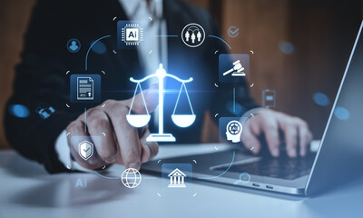 Legal tech and AI integration concept with justice scale icons over businessperson using laptop on digital interface background in modern office environment.