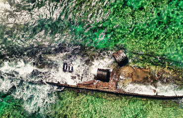 Aerial view of Mildura Wreck shipwreck on the coast of Exmouth, Western Australia from above