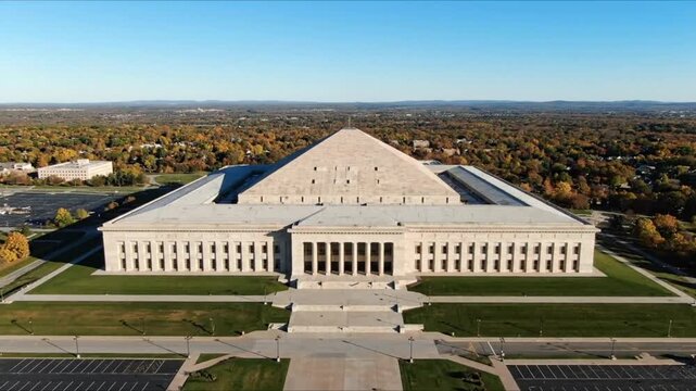 Aerial view of the exterior of the Ohio Statehouse and State Office Tower against a clear blue sky