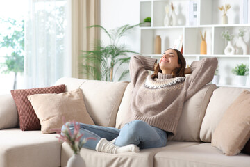 Happy woman in winter relaxing and breathing at home