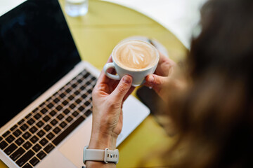 cappuccino laptop cafe business drink table cup computer technology morning espresso cappuccino mug closeup office breakfast caffeine work desk