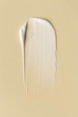 White Cosmetic Cream Smear on Beige Background