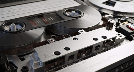 Vintage reel to reel tape recorder mechanism in detail. Retro analog audio equipment for sound recording and data storage
