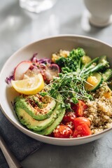 healthy lunch bowl with quinoa, avocado and vegetables