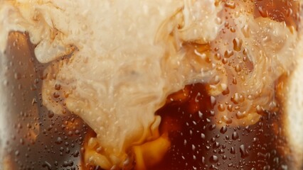 Macro Shot of Pouring Milk into Ice Coffee, Close-up