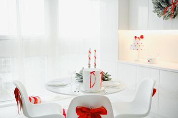 Festive table setting with cake and decorations for a holiday celebration