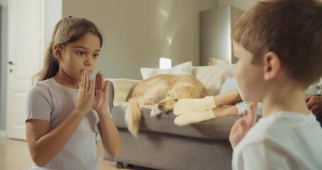 Brothers and sisters engage in coordinated rhythm exercises