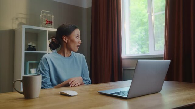 Woman see middle finger remote, obscene hand gesture from laptop screen. Person visit suspicious phishing scam website. Online gambling fail. Work failure. Funny joke, humor. Internet fraud.