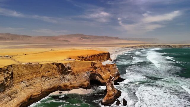 Aerial drone view of the Pacific Ocean and cliffs in Paracas. Dramatic Pacific landscape. Panoramic coastal view. Peru. Region Ica.	