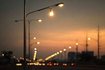 Street lights at sunset, street in the city of night background. High quality