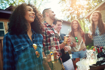 Obraz premium Conversation, smile and friends in backyard with drinks for event, reunion or gathering together. Happy, talking and group of people with beers for bonding, fun or hangout outdoor at home on weekend.