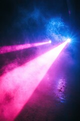 Laser light show. Bright LED laser beams, blue and pink stage lighting, LED strobe lights. Background