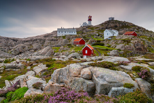 southernmost point of Norway with the houses and Lindesnes Lighthouse at sunset - Powered by Adobe