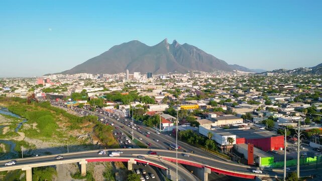 Monterrey traffic on the highway with Cerro de la Silla in the background. Static 4K video