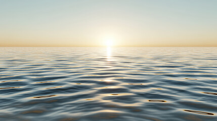Fototapeta premium Calm ocean at sunrise with gentle rippling water and warm light