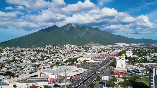 Cerro de La Silla with blue sky and white clouds. Drone 4K panoramic view of Monterrey, Nuevo Le&oacute;n, Mexico.