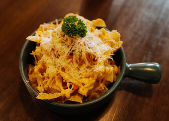 Close up deep fried Wonton topped with Mozzarella cheese and crispy bacon