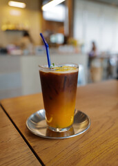 Close up glass of iced espresso coffee shot with orange juice