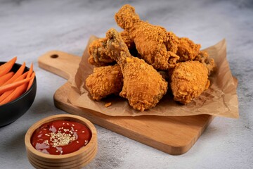 Crispy fried chicken wings and fries with dipping sauce