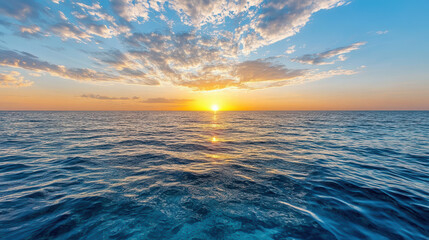 Mirror like sea surface at sunset peaceful warm horizon glow