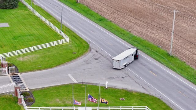 Truck and Livestock Trailer Leaving University of Findlay Farm Gate, Findlay, Ohio, USA