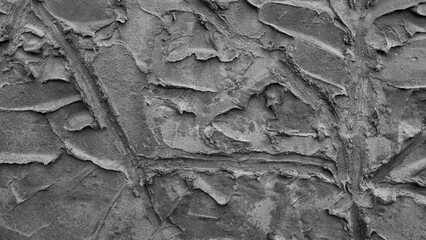 gray background, in the photo the texture of a gray wall with various lines, strokes and cracks