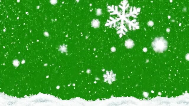 Falling snowflakes on a vibrant green background capturing winter holiday atmosphere and seasonal festive spirit with dynamic snow motion