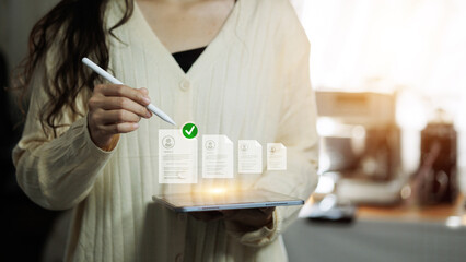 HR manager selecting digital resume on tablet with hologram interface.