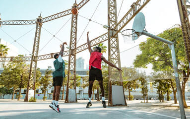 Young basketball players training at the court.