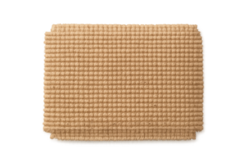 Beige woven rectangular rug folded in half, showcasing textured fibers