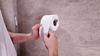 Man with urge to go to the toilet at home.