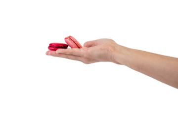 Pink and red macarons in hand on transparent background
