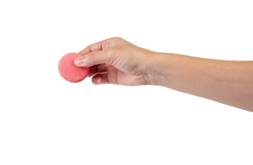Pink and red macarons in hand on transparent background