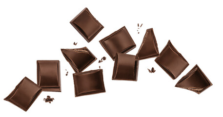 Flying dark chocolate squares isolated on white background, broken chocolate pieces in dynamic motion with copy space
