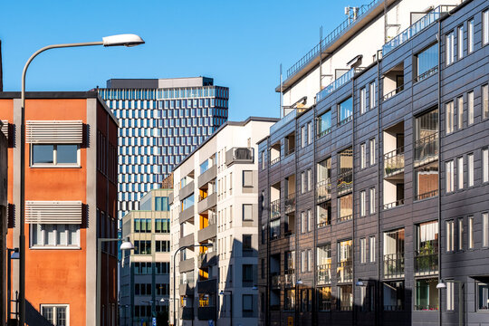 Residential architecture in modern Stockholm captured through facade contrasts that emphasize building design and development across the cityscape of Hammarbyhamnen