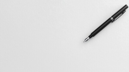 A black fountain pen with a silver nib and clip.