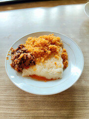 Indonesian Grilled Sticky Rice Snack Served with Oncom and Flakes