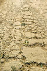 Background texture of dark gray asphalt, top view. Cracked asphalt texture. Road background. Above, high angle. Copy space, empty space, free space. Sstkbackgrounds. flat lay.